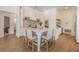 Bright, white kitchen with large island and breakfast bar seating and modern appliances at 9126 Cypress Keep Ln, Odessa, FL 33556