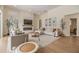 Spacious living room with modern fireplace, large windows, plantation shutters, and stylish decor at 9126 Cypress Keep Ln, Odessa, FL 33556