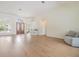 Open living room featuring hardwood floors and high ceilings at 9126 Cypress Keep Ln, Odessa, FL 33556