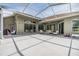 Expansive screened patio with outdoor seating, perfect for entertaining and relaxing outdoors at 9126 Cypress Keep Ln, Odessa, FL 33556
