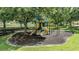 Neighborhood playground with slides, swings, and climbing structures surrounded by mature trees at 9126 Cypress Keep Ln, Odessa, FL 33556