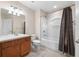 Well-lit bathroom with modern fixtures, tile floors, and a shower-tub combo at 10208 Westpark Preserve Blvd, Tampa, FL 33625