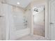 Bathroom features a shower-tub combo with white tile at 10208 Westpark Preserve Blvd, Tampa, FL 33625