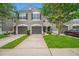 A charming townhouse featuring a well-manicured lawn and neat landscaping at 10208 Westpark Preserve Blvd, Tampa, FL 33625