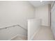 Second floor hallway with carpet runner and hallway closet at 10208 Westpark Preserve Blvd, Tampa, FL 33625