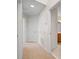 Hallway with neutral carpet, white doors, and access to rooms at 10208 Westpark Preserve Blvd, Tampa, FL 33625
