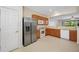 Well-lit kitchen featuring stainless steel refrigerator and white appliances at 10208 Westpark Preserve Blvd, Tampa, FL 33625
