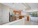 Kitchen with stainless steel appliances and a view of the living area at 10208 Westpark Preserve Blvd, Tampa, FL 33625