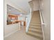 Bright kitchen area with tile flooring and a staircase view at 10208 Westpark Preserve Blvd, Tampa, FL 33625