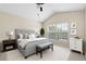 Spacious main bedroom with a ceiling fan and large window at 10208 Westpark Preserve Blvd, Tampa, FL 33625