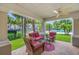 Inviting covered patio with ceiling fan and a view of the community pool at 10208 Westpark Preserve Blvd, Tampa, FL 33625