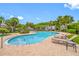 Resort-style community pool featuring lounge chairs and lush tropical landscaping at 10208 Westpark Preserve Blvd, Tampa, FL 33625