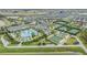 A high angle shows the community center with pool, clubhouse, and tennis and bocce ball courts at 10278 Otter Sky Ct, San Antonio, FL 33576