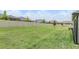 Expansive, well-maintained backyard with lush green grass and privacy fencing for outdoor enjoyment at 10278 Otter Sky Ct, San Antonio, FL 33576