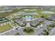 Aerial view of community clubhouse, outdoor pool, and bocce ball court at 10278 Otter Sky Ct, San Antonio, FL 33576