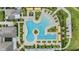 Overhead shot of a community pool with lounge chairs and nearby neighborhood homes at 10278 Otter Sky Ct, San Antonio, FL 33576