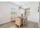 Cozy dining area featuring a modern table, chairs, and a stylish light fixture, perfect for Gathering meals at 10278 Otter Sky Ct, San Antonio, FL 33576