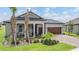 Charming single-story home with a well-manicured lawn, inviting entrance, and a two-car garage, showcasing curb appeal at 10278 Otter Sky Ct, San Antonio, FL 33576