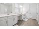 Bright and spacious main bathroom with double sinks, quartz countertops, and modern tile flooring at 10278 Otter Sky Ct, San Antonio, FL 33576