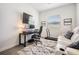 Dedicated office space featuring a modern desk, comfortable seating, and inspirational decor at 10278 Otter Sky Ct, San Antonio, FL 33576