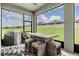 Screened patio offers outdoor dining with bar-height seating and a grill for casual entertaining at 10278 Otter Sky Ct, San Antonio, FL 33576