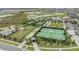 Overhead shot of community tennis courts and recreation area with landscaping at 10278 Otter Sky Ct, San Antonio, FL 33576