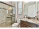 Bathroom features include a tiled shower and granite countertop vanity at 10701 Morning Dew Way, Tampa, FL 33647