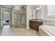 Beautiful bathroom with corner shower and soaking tub at 10701 Morning Dew Way, Tampa, FL 33647