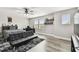 Bedroom features modern furniture, many windows, and hardwood floors at 10701 Morning Dew Way, Tampa, FL 33647