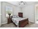 Bedroom with carpeted floors, side tables and matching armoire at 10701 Morning Dew Way, Tampa, FL 33647