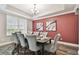 Formal dining room showcasing elegant decor and seating for six at 10701 Morning Dew Way, Tampa, FL 33647