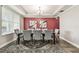 Elegant dining room featuring a stylish rug, modern lighting, and comfortable seating at 10701 Morning Dew Way, Tampa, FL 33647
