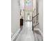 Bright foyer with wood floors, staircase and front door with glass panels at 10701 Morning Dew Way, Tampa, FL 33647