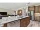 Spacious kitchen island with granite countertop, stainless steel appliances, and ample cabinet space at 10701 Morning Dew Way, Tampa, FL 33647