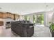 Open floor plan with living room flows to the kitchen and outdoor patio at 10701 Morning Dew Way, Tampa, FL 33647