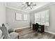 Cozy home office with hardwood floors, natural light, and a functional workspace at 10701 Morning Dew Way, Tampa, FL 33647