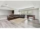 Finished basement with hardwood floors, wet bar, foosball table, and comfortable seating area at 10701 Morning Dew Way, Tampa, FL 33647