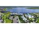 Aerial view showcasing community pool, lake, clubhouse and lush landscaping in a beautiful neighborhood at 12215 Blue Pacific Dr, Riverview, FL 33579