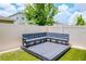 Backyard featuring a built-in deck with sectional seating on artificial turf at 12215 Blue Pacific Dr, Riverview, FL 33579