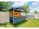Backyard showcasing an outdoor bar area and custom deck seating at 12215 Blue Pacific Dr, Riverview, FL 33579