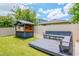 The backyard showcases a bar with a deck and built-in seating at 12215 Blue Pacific Dr, Riverview, FL 33579