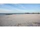 Picturesque beach with white sand and calm blue water under a clear sky at 12215 Blue Pacific Dr, Riverview, FL 33579
