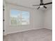 Bright bedroom features a ceiling fan and a window with natural light at 12215 Blue Pacific Dr, Riverview, FL 33579