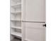Open closet featuring multiple shelves and a hanging rod at 12215 Blue Pacific Dr, Riverview, FL 33579