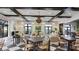 Elegant clubhouse featuring stylish seating areas and views of the surrounding lake at 12215 Blue Pacific Dr, Riverview, FL 33579