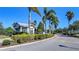 Well-maintained community entrance with lush greenery and a charming gatehouse at 12215 Blue Pacific Dr, Riverview, FL 33579