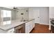 Kitchen with modern faucet, stainless dishwasher, granite counters, and wood-look floors at 12215 Blue Pacific Dr, Riverview, FL 33579