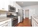 Modern kitchen features stainless steel appliances, granite countertops, and ample cabinet space at 12215 Blue Pacific Dr, Riverview, FL 33579