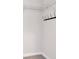 Walk-in closet features wire shelving and a row of black hooks at 12215 Blue Pacific Dr, Riverview, FL 33579