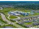 Aerial view of community showing a school, homes, roadways and recreational areas at 12931 Twin Bridges Dr, Riverview, FL 33579